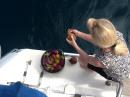 Yummy: Gwen does the salt water debugging of fresh produce before it comes aboard. Keeps the bugs down. 